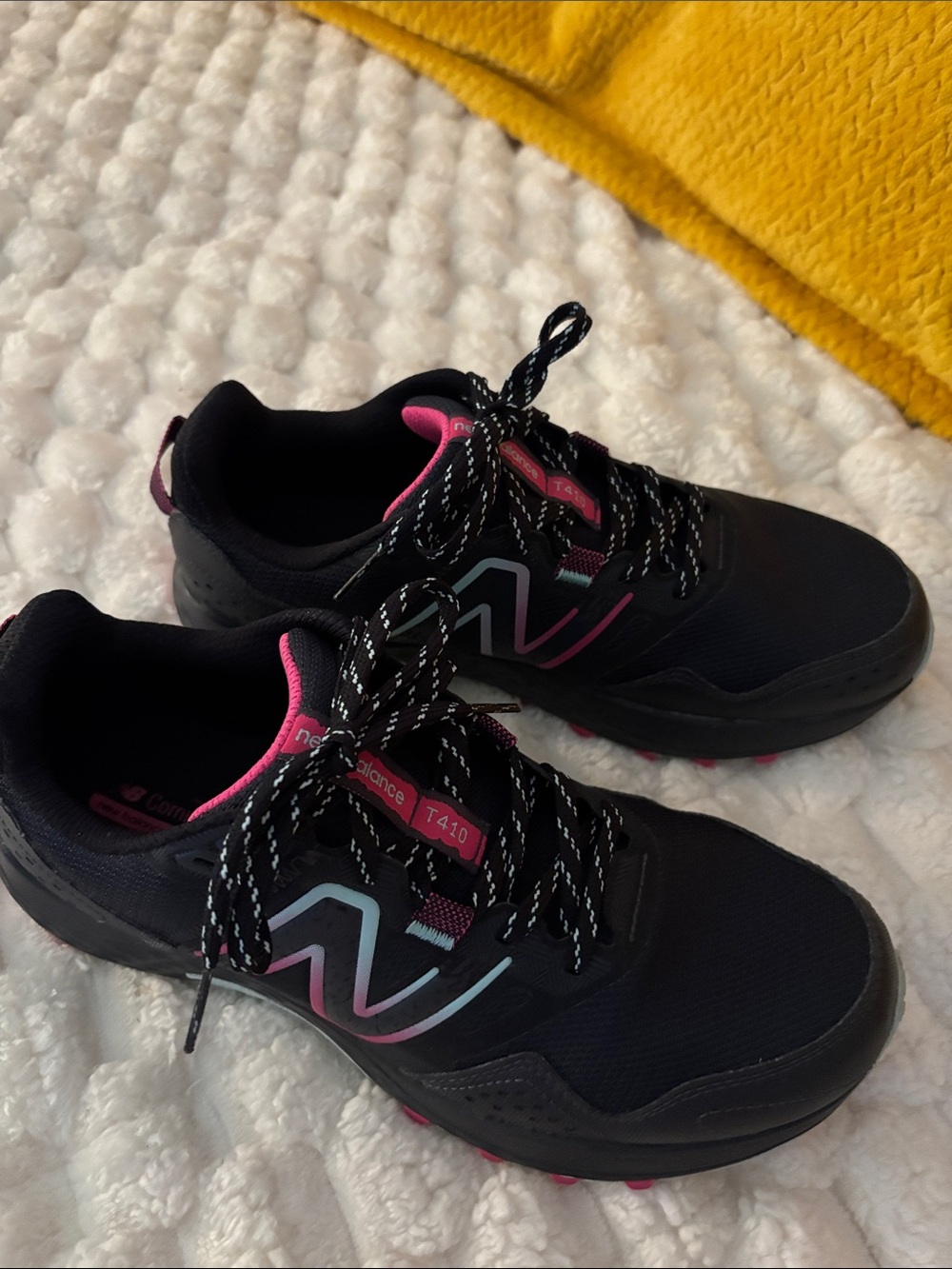 New Balance Black Sneakers with Pink & Light Blue Accents